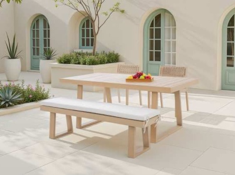 Pale wood dining table, bench with white cushion and woven chairs