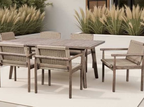 Grey-brown table and six rope-woven chairs on a white rug