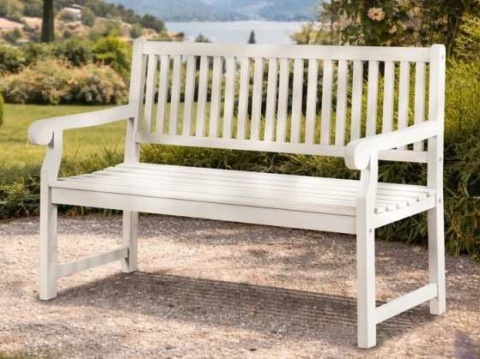 White wooden bench with a tall back and scrolled arms on a gravel path