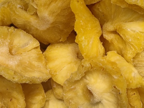Yellow dried pineapple rings filling the frame