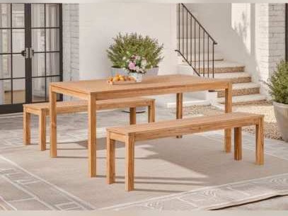 Eucalyptus dining table with two benches on a terrace rug