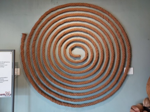 Coir rope wound into a large flat spiral on a wall