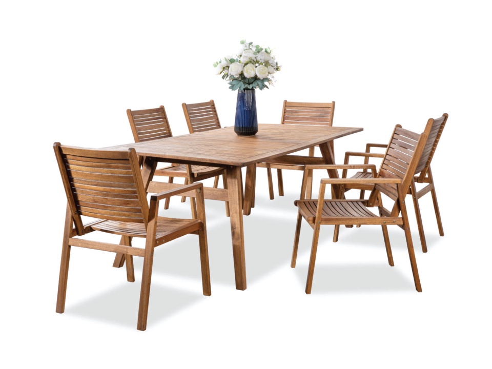 Brown wood dining set with slatted-back chairs, beige cushions and a flower vase