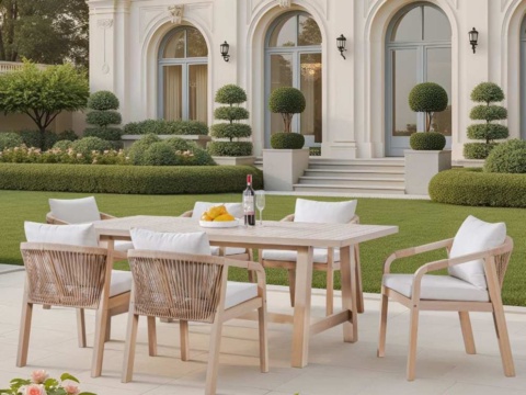 Rectangular dining table with rope-back armchairs on a paved terrace