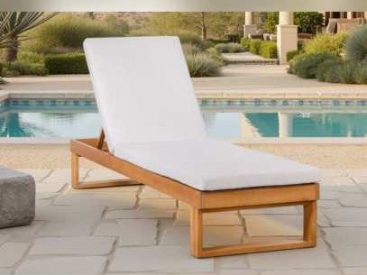 Wooden square-leg sun lounger with white cushion beside a pool