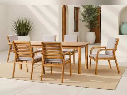 Rectangular dining table and slat-back armchairs with grey cushions