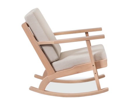 Side view of a light wood rocking chair with cream cushions, white background
